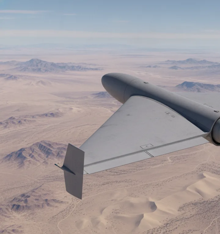 Delta-wing pusher UAV in flight over arid terrain — Tactical Tier configuration concept render